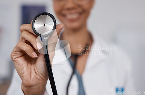 Image of Cardiology doctor, stethoscope closeup and black woman in healthcare, heart wellness and consultation pov. Friendly medical professional or cardiologist in clinic or hospital exam with happy service