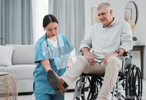 Image of Wheelchair help, nursing home and man with injury or disability with nurse support. Wellness, healthcare and retirement of a elderly person with foot pain from a medical problem with caregiver