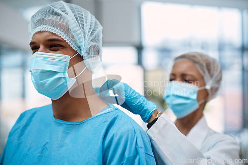 Image of Surgeon team, doctors and surgery with face mask and health, help with ppe for safety, operation and ready for procedure. Cardiovascular, clean scrubs and people in clinic with physician partnership