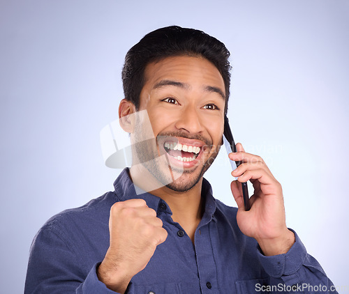 Image of Happy, excited and Asian man on a phone call for promotion isolated on a purple background in studio. Winning, communication and businessman on a conversation about success, good news and achievement