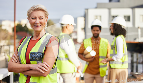 Image of Senior architect woman, outdoor portrait and rooftop with leadership, smile and vision for property development. Elderly architecture expert, arms crossed or focus for happiness, team and career goal