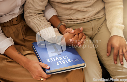 Image of Love, bible and couple holding hands, studying and support with religious practice, teaching and growth for marriage. Holy text, man and woman bonding, scripture and prayer with connection or healing