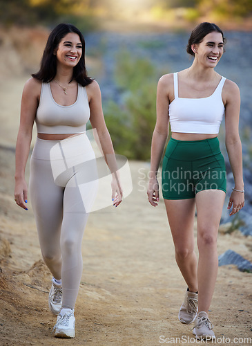 Image of Fitness, hiking and women with smile, mountains and bonding with balance, fresh air and healthy lifestyle. Female hikers, athletes and friends walking in nature, happiness and countryside for journey