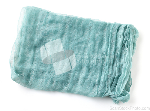 Image of folded crumpled blue cotton napkin