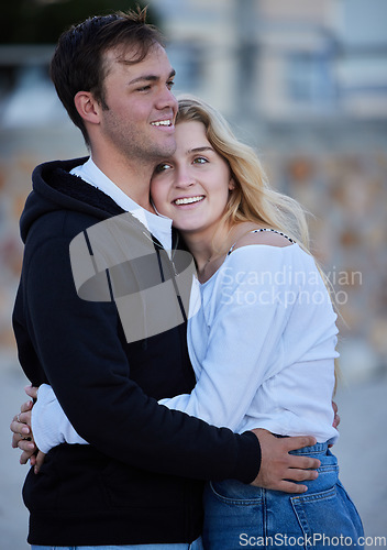 Image of Love, hug and travel with a tourist couple outdoor together in a foreign country for a vacation or holiday. Trust, tourist or hugging with a young man and woman traveler overseas for a getaway