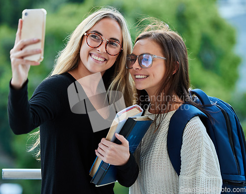 Image of Selfie, women and students on campus, goals and happiness with success, cheerful and books. Females, girls and academics with smartphone, social media and connection outdoor and picture for memories