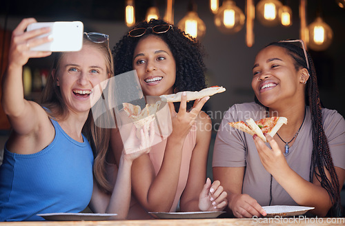 Image of Woman, friends and pizza for selfie, memory or eating at restaurant together for social media post. Happy women smiling for photo, vlog or profile picture in friendship enjoying food and bonding time