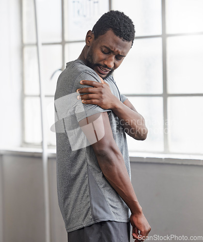 Image of Shoulder injury, black man and pain in gym from exercise, medical emergency and injured muscle, bruise or joint. Male, arm and fitness accident from workout, first aid and health risk in sports club