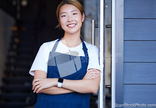 Image of Happy, cafe and portrait of Asian woman at door for welcome, waitress and entrepreneur in startup. Small business, smile and manager with girl barista in coffee shop for retail, restaurant or service