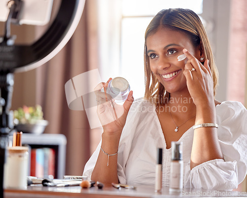 Image of Beauty influencer, cream and woman live streaming for makeup, cosmetics and fashion vlog. Content creator, social media and girl record, review and film tutorial on phone with skincare facial product