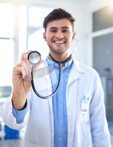 Image of Cardiology doctor, stethoscope and man in portrait for healthcare, heart wellness and consultation pov in hospital. Friendly medical professional or cardiologist in clinic exam for happy services