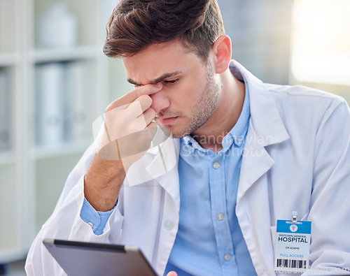 Image of Headache, stress and tired doctor on tablet with anxiety, pain or overworked for healthcare research. Fatigue, burnout and medical professional frustrated, sad or angry for digital technology problem