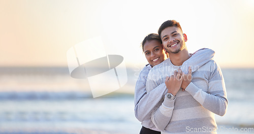 Image of Portrait, beach and mockup with a couple hugging outdoor in nature at sunset during summer vacation. Love, nature or seaside with a young man and woman sharing a hug on the coast by the ocean