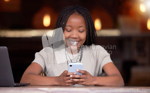 Image of Black woman, phone and smile for social media, communication or chatting and texting at cafe. Happy African American female freelancer smiling for wifi on mobile app, browsing or chat on smartphone