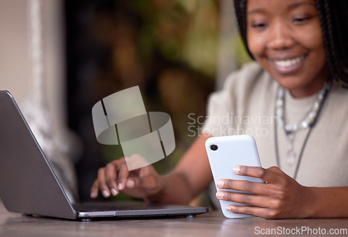 Image of Black woman, phone and laptop in remote work for communication, social media or chatting at cafe. Hands of happy African American female freelancer with smile working on computer and smartphone