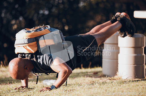 Image of Pushup, training and black man at a fitness bootcamp for exercise, workout and sports. Strong, bodybuilder and athlete doing a cardio challenge, physical activity and strength routine on a field