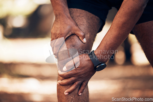 Image of Knee pain, senior hands and injury in nature after accident, workout or training. Sports, athlete health and elderly black man with fibromyalgia, inflammation or tendinitis, arthritis or painful legs