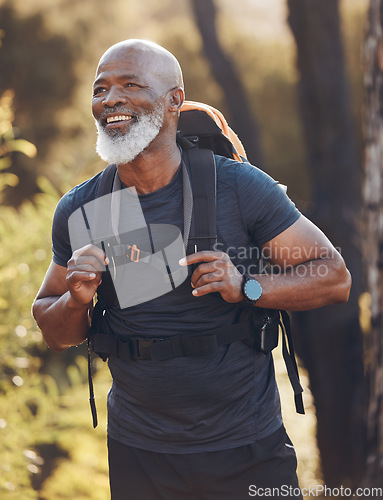 Image of Senior black man hiking in nature for walking fitness, retirement wellness and carbon footprint travel journey in forest. Happy hiker or camper person trekking in woods with health journey and cardio