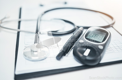 Image of Stethoscope, medical and diabetes equipment with and clipboard for checklist, documents or healthcare. Medicine, research and information with paperwork for life insurance, analysis or consulting