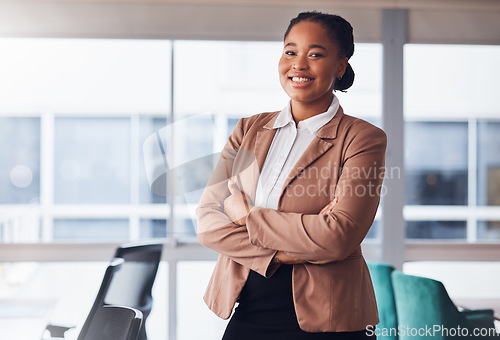 Image of Black woman, business and portrait with a smile in office with pride for career or job as leader. Young entrepreneur person happy about growth, development and mindset to grow startup company