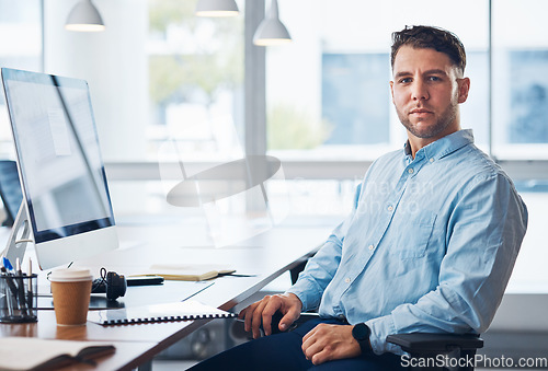 Image of Businessman, portrait and serious financial advisor by computer with documents in sales sitting by office desk. Corporate male employee by desktop PC on chair ready for finance advice, loan or help