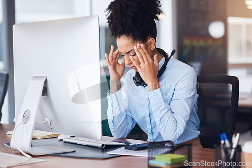 Image of Headache, stress and business black woman at desk with computer problem, head pain and fatigue in office. Burnout, mental health and female worker tired, frustrated and overworked with migraine