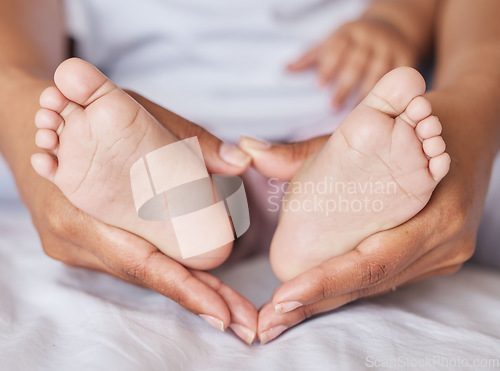 Image of Closeup, feet and baby with mother, hands and care for kid, support and touch for bonding and playful. Zoom, mama and infant with health, wellness and newborn with female parent or child development
