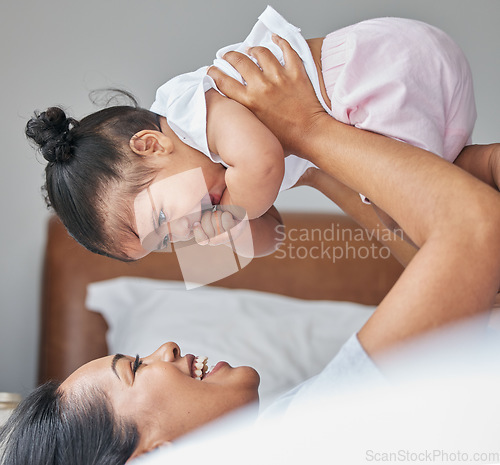 Image of Love, mother and baby in bedroom, air and care with happiness, playful and cheerful. Mama, female child and kid on bed, smile and bonding together, break and loving with toddler, family and relax