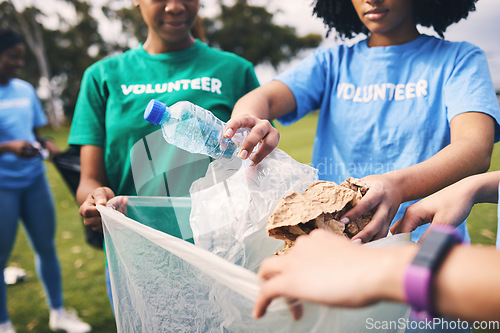 Image of Recycle, plastic bag and ngo volunteer group cleaning outdoor park for sustainability. Nonprofit, recycling project and waste clean up in nature for earth day, climate change and community support