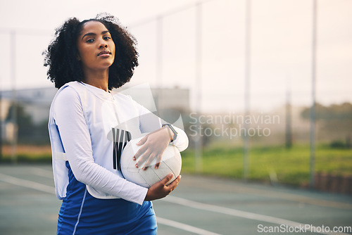 Image of Sports, netball and portrait of female with a ball after match, exercise or training on the court. Confidence, fitness and serious black woman athlete standing on field for game, workout or practice.