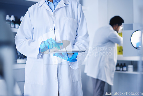 Image of Scientist, hands and working on tablet in laboratory for planning, innovation and online research. Science, worker and digital medicine for development, data analysis and biotechnology investigation