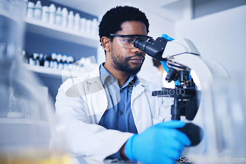 Image of Microscope, science and black man working on study in laboratory for medical research analysis. Scientist, microbiology and biotechnology worker check investigation, innovation and dna pathology test