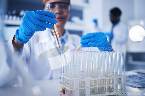 Image of Science, test tube in hands and black woman in laboratory for research, medical study and experiment. Healthcare, pharmaceutical and female scientist with liquid vial, medicine and vaccine in clinic