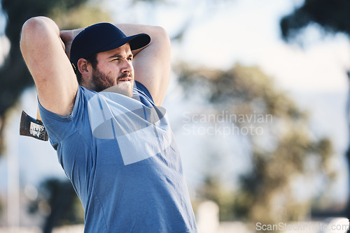 Image of Sports, training and man throw axe on range for adventure, exercise and target practice competition. Extreme sport, hunting skill and male archer aim with tomahawk weapon for action, games and hobby