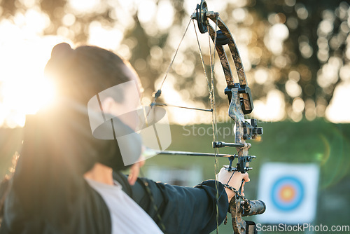 Image of Archer woman, target and bow and arrow practice for outdoor archery, athlete challenge or girl field competition. Shooting goals, talent and competitive focus on precision training, aim or objective