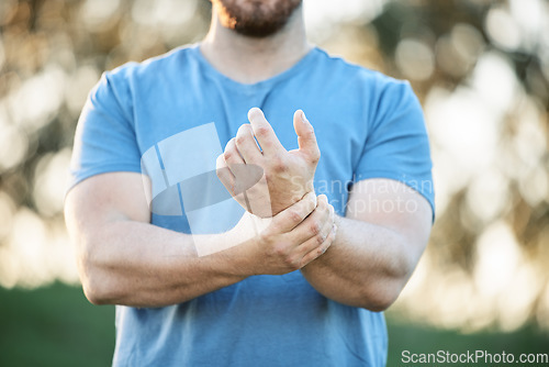 Image of Injury, sports and man with wrist pain from a workout, exercise accident and sprain from cardio. Fitness, emergency and athlete with carpal tunnel syndrome, inflammation and injured arm from training
