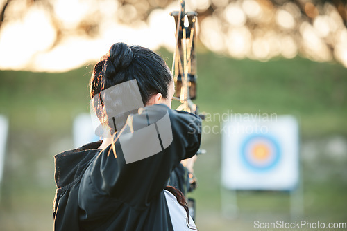 Image of Archer, arrow target training and practice for archery competition, athlete challenge or competitive shooting. Sports field girl, bow hunting and woman focus on precision, aim or back view objective