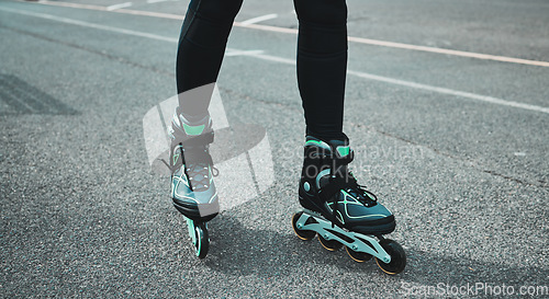 Image of Street, sports and legs of a woman roller skating for fitness, learning and training in the city. Urban, sport and feet and shoes of a person in the road to learn to skate, exercise and hobby