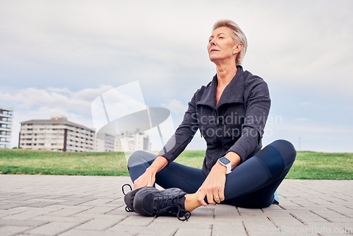 Image of Woman, breathing and stretching exercise at park, sky mockup and ground for training in Miami. Senior female, breathe and fitness outdoor for workout, sports and meditation for healthy runner mindset