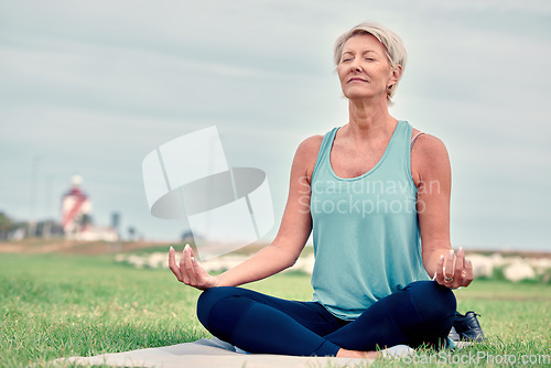 Image of Meditation, senior woman and mudra exercise at park for wellness, mental health or fitness on sky mockup. Elderly lady meditate outdoor to relax in peace, healing mindset or zen hands of yoga workout