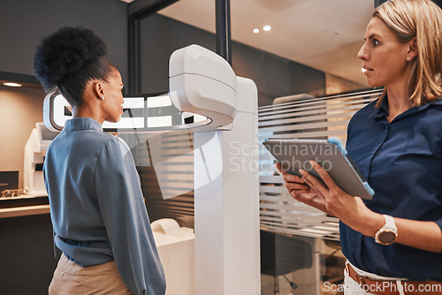 Image of Eye exam machine, black woman and optometrist with tablet for vision test, eyesight and optical assessment. Ophthalmology, medical tech and optician in patient consultation for retina, eyes and lens