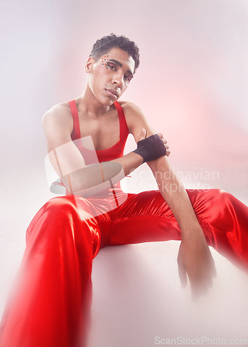 Image of Fashion, retro and portrait of lgbt man or model with style posing as a fashionable and trendy person blurred studio background. Isolated, stylish and cool gen z clothes in vintage aesthetic outfit