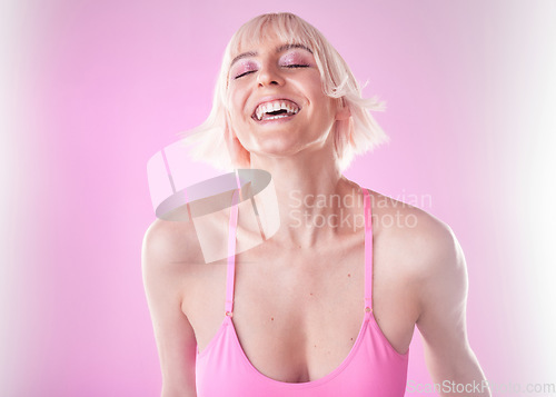 Image of Fashion, makeup and happy woman closed eyes in sportswear isolated against a studio pink background. Smile, fun and joyful model or gen z person laugh for funny joke in exercise, workout or fitness