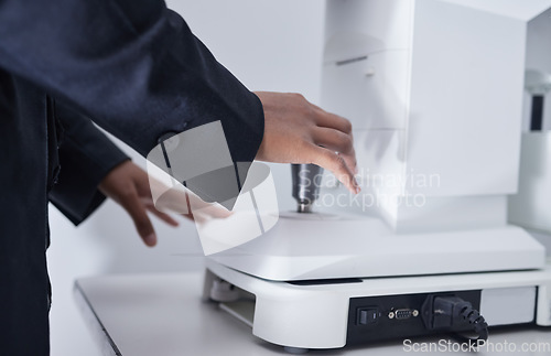 Image of Ophthalmologist, glaucoma and optometrist hands on machine for eye exam for vision care, health and wellness. Closeup, professional and healthcare specialist test lenses for optometry in clinic