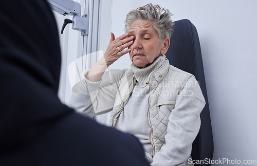 Image of Senior woman, ophthalmology and eye pain with hand in clinic consultation for vision, wellness or health. Elderly patient, explain problem and talk with doctor for eyes, headache or medical solution