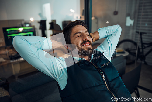 Image of Business man, relax or productivity success at home office with hand on head for achievement, thinking about goals or target. Happy, smile or entrepreneur on chair for break or peace for work done