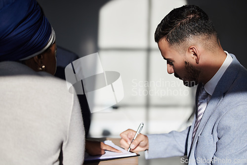 Image of Interview, man and signing contract, job interview and recruitment in workplace, sunlight and conversation. Business, male employee and recruiter in office, contract and documents for employment