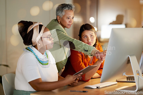 Image of Teamwork, manager support or business women on computer at night for research, communication or creative strategy. Startup, diversity or collaboration on tech for networking, reading website or news