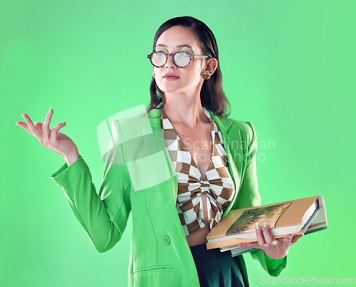 Image of Woman, books and teacher mockup in studio isolated on a green background. Gen z, education and smart female professor with product placement, advertising or marketing space while carrying textbooks.