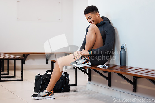 Image of Fitness, tying shoes and black man in locker room for training, sports and gym workout. Exercise, health and start cardio with athlete and dressing sneakers for gear, wellness or ready for practice